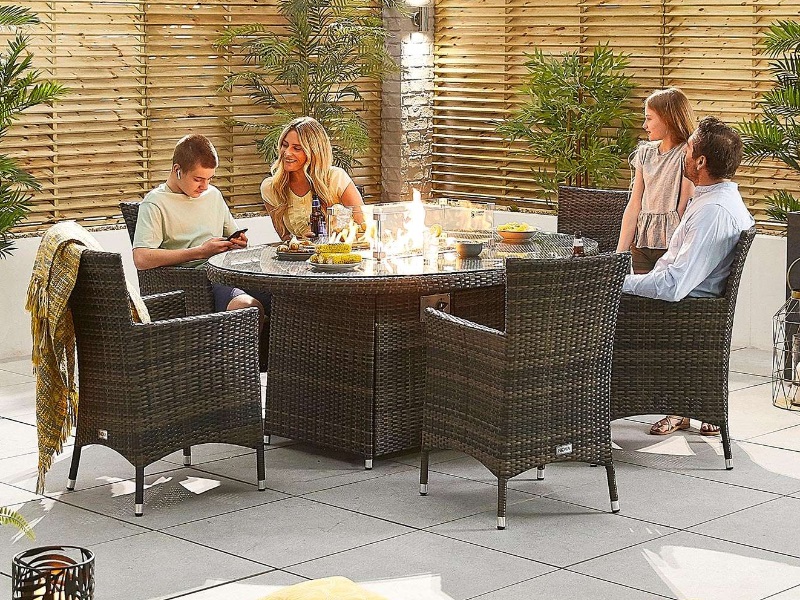 Nova Outdoor Living Amelia 6 Seat Dining Set with Fire Pit - 1.8m x 1.2m Oval Table Brown Rattan Dining Set Image0 Image