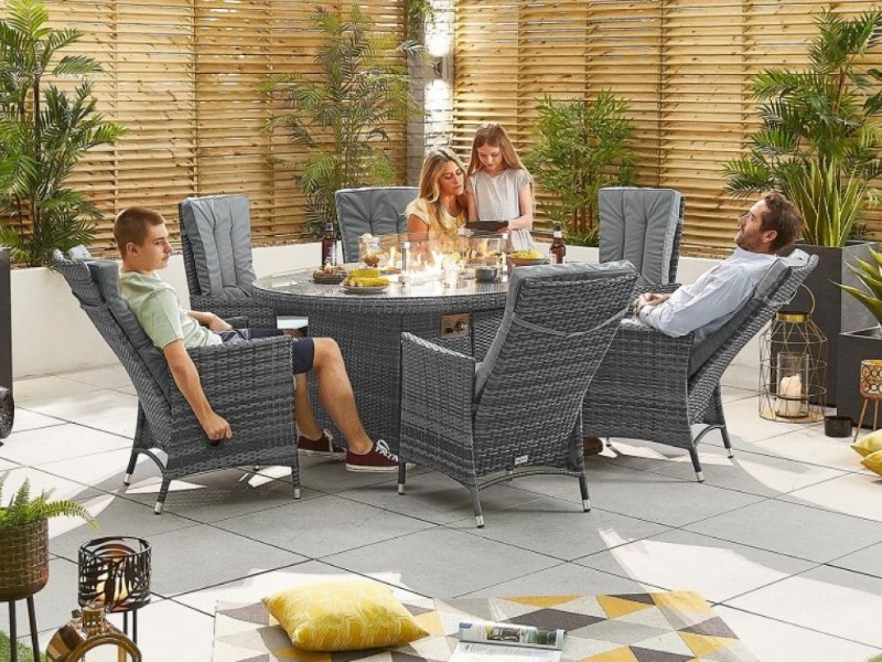 Nova Outdoor Living Ruxley 6 Seat Dining Set with Fire Pit - 1.8m x 1.2m Oval Table Grey Rattan Dining Set Image0 Image